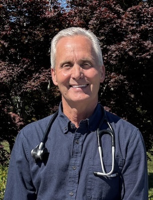 Dr. Bailey stands outside