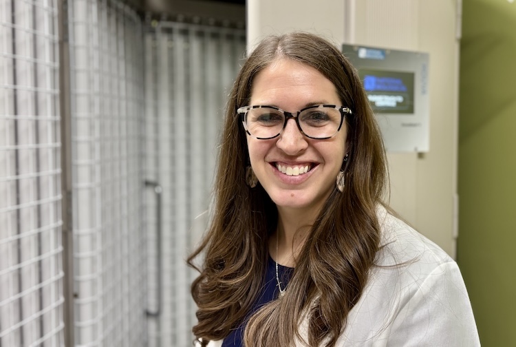 A physician stands beside VCU Health Community Memorial Hospital’s new phototherapy machine, providing advanced treatment for individuals with eczema and psoriasis.