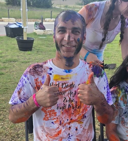Dr. Khan smiles at Camp Hope