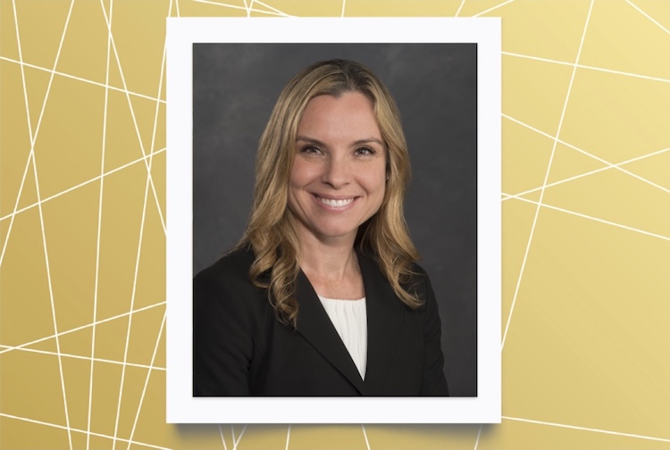 Woman in black suit smiling