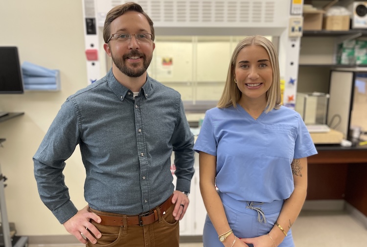 Engineer Casey Grey and VCU Health nurse Emma Necessary stand together in an engineering lab on VCU’s Monroe Park Campus.
