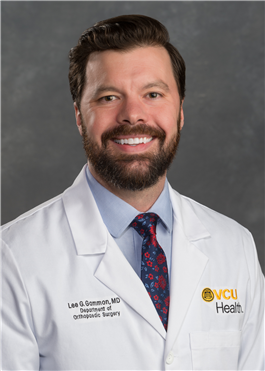 Dr. Lee Gammon in a white medical coat