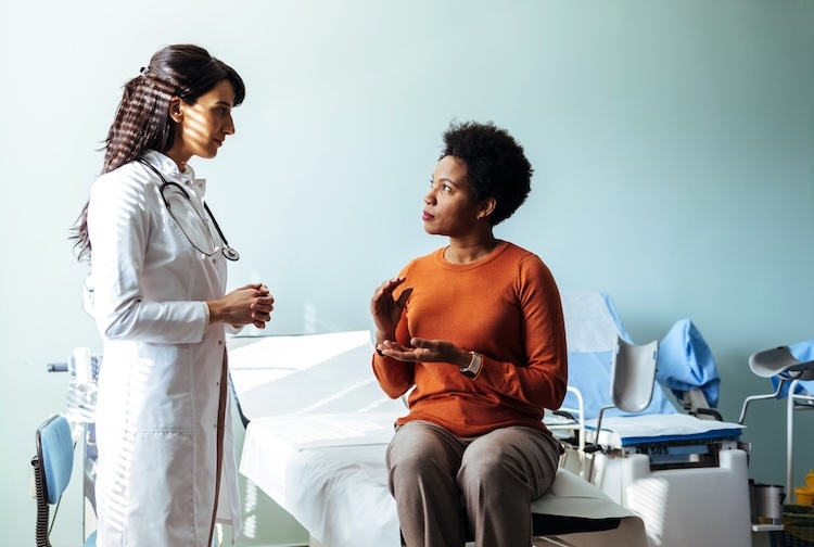 Female patient speaking with her OB-GYN.