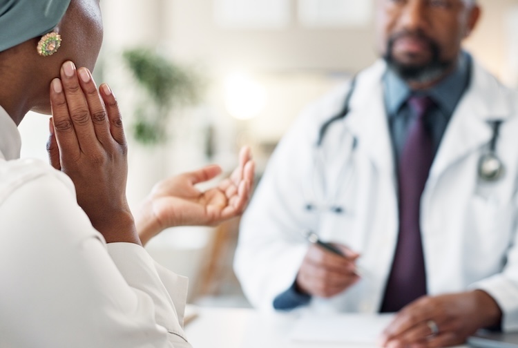 Woman speaking with doctor