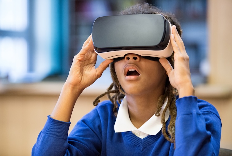 Teen looking through a virtual reality headset