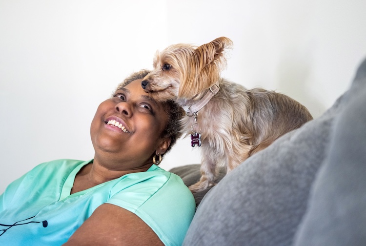 VCU Health patient VCU Health patient Ericka looks up at her small dog