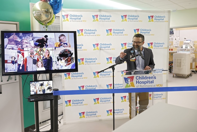 Hugh Cline sharing his journey at the podium