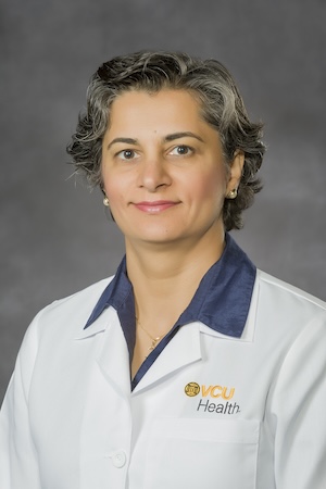 Dr. Alattar in her medical white coat