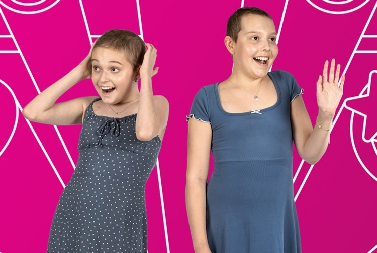 Two girls in dresses smiling