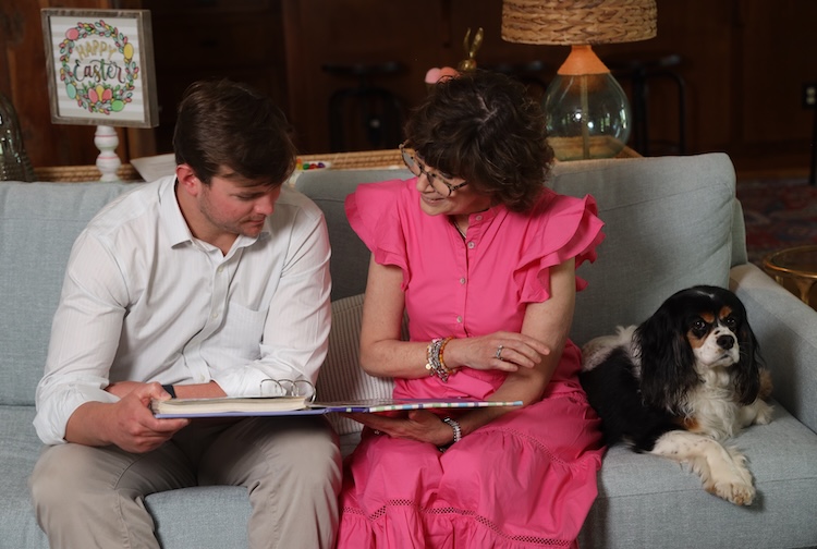 Mary Beth Brault sits with her son and dog on a couch