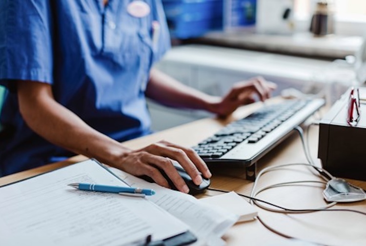 nurse on a computer
