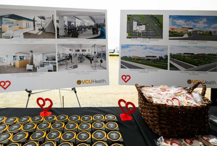 Table with Posters showcasing the renderings of the Pauley Pavilion