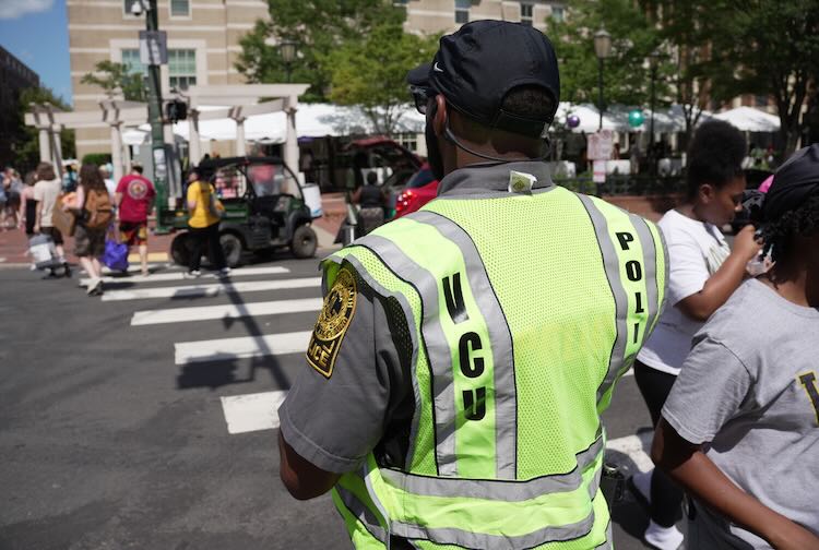 VCU Police at the crosswalk assisting pedestrians