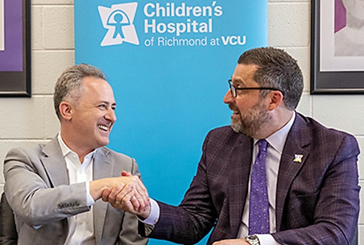 CHoR President Elias Neujahr shakes the hand of RPS Superintendent Jason Kamras