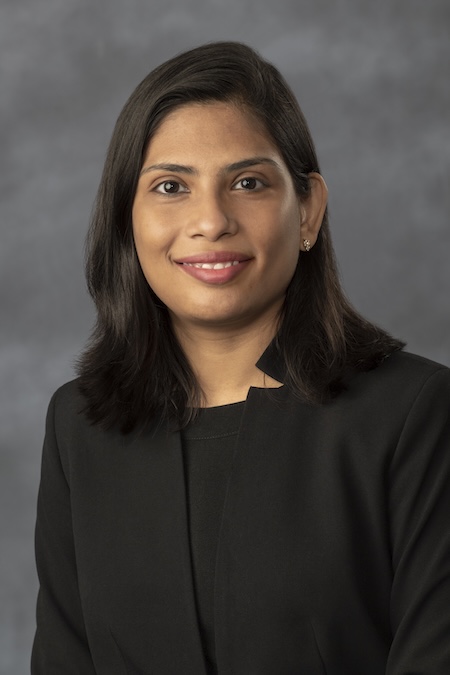 Dr. Jayakumar in a wearing a black blouse and blazer.