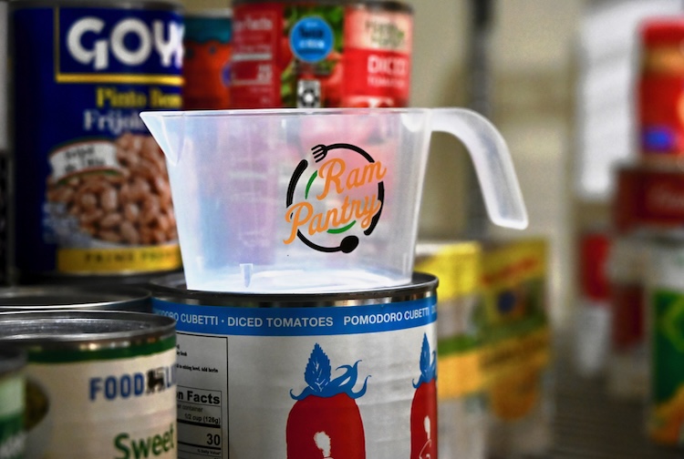 Cans of beans next to a measuring cup that says Ram Pantry
