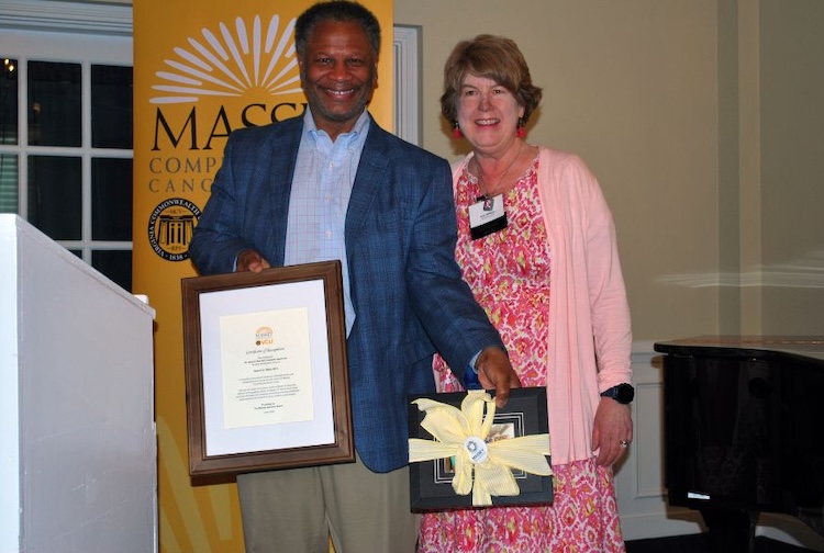 Dr. Winn stands with advisory board chair Amy Williams