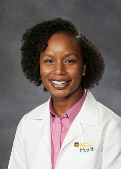 Dr. Kim Salkey in a white medical coat