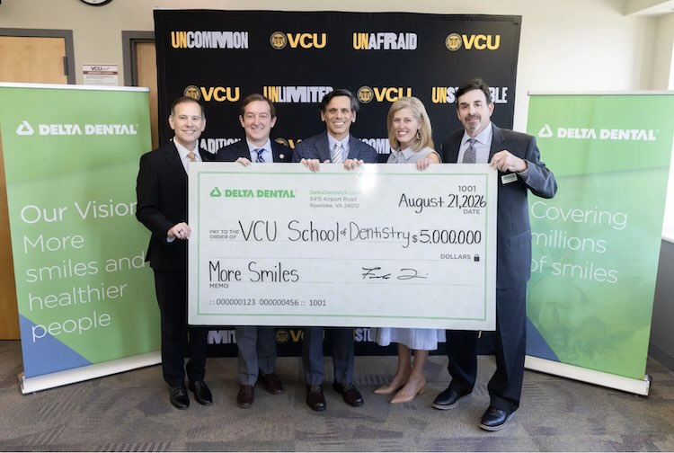 School Officials and Delta Dental Leadership holding giant check