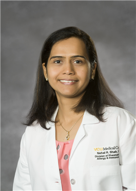 Dr. Nehal R. Shah in a white medical coat