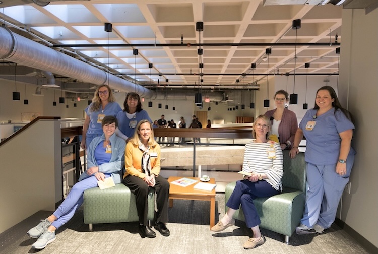 Group of VCU Health team members sitting together in new office space