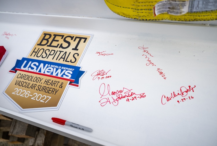 Signatures on the beam, and a badge saying best hospital for cardiology, heart and vascular surgery from US News and World Report.