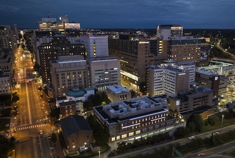 Aerial view of the city of Richmond at night with all the VCU Medical Center campus.