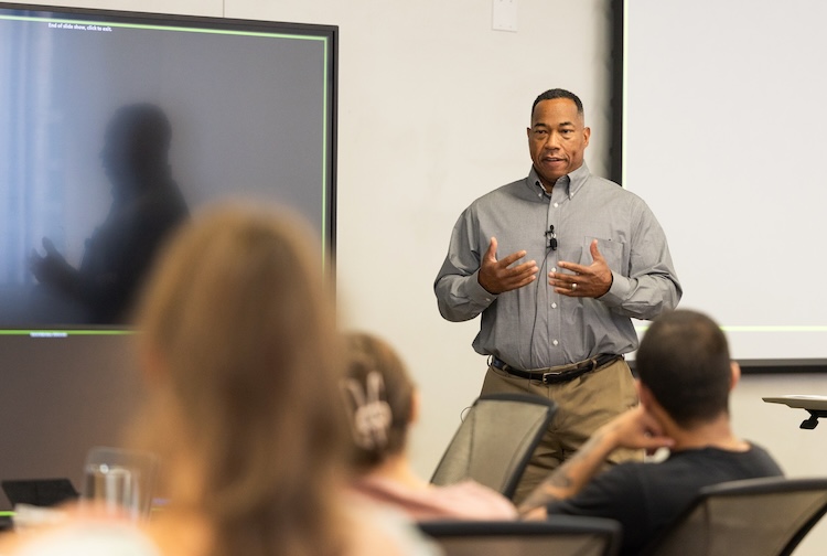 Johnny Boatman speaks to a class about his diagnosis.
