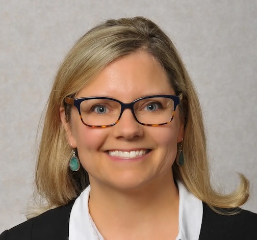 Blonde woman with glasses