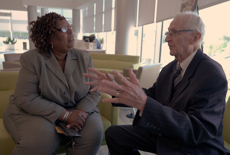 Woman and man speaking together
