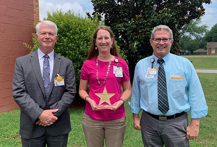 VCU Health CMH CEO Scott Burnette, Foundation Coordinator Rebecca Sontag and Director of Marketing and Development Ken Kurz.