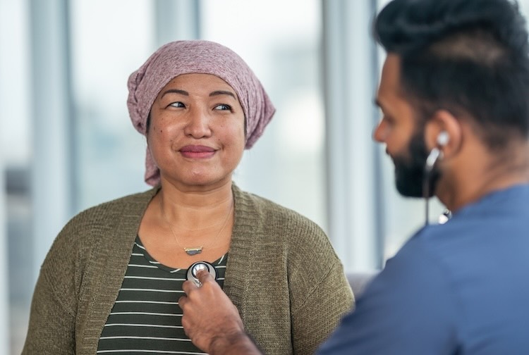Cancer patient has heart checked by doctor