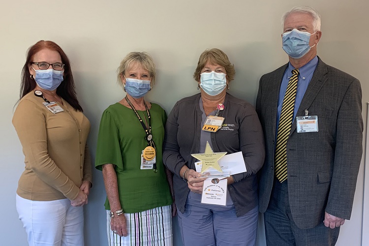 CMH staff with Team Member of the Month, Donna Overton