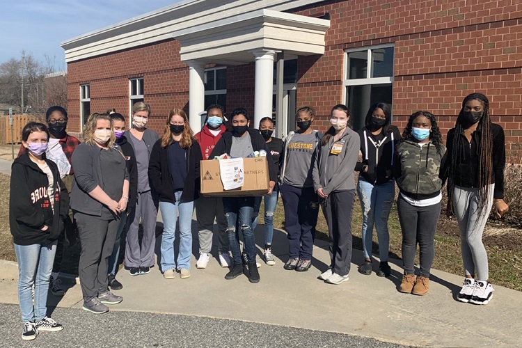 Bluestone High School students standing with CMH Clinical Coordinator Ashley Willis