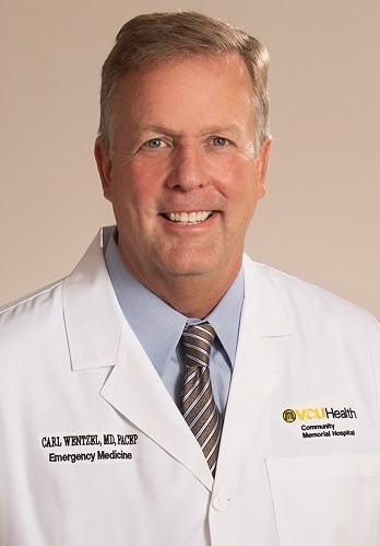 Dr. Carl Wentzel in a white medical coat