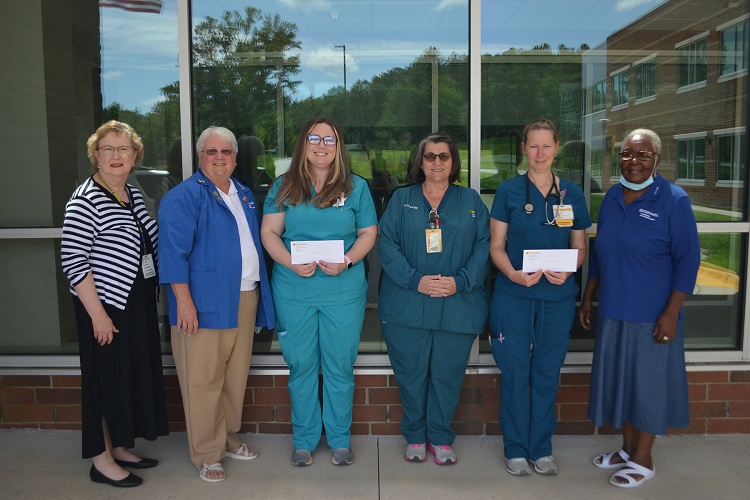 CMH team members presenting awards to Elizabeth T. Moseley Scholarship Fund winners