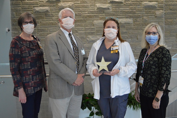 Erin Davis, CMH Team Member of the Month, and CMH team members