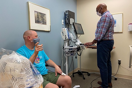 VCU Massey Cancer Center patient Jeff Eastman with Todd Adams, M.D. on his final day of radiation. Image shared by Jeff Eastman. 