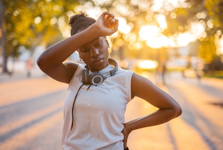 Woman Exhausted After Jogging In The Park