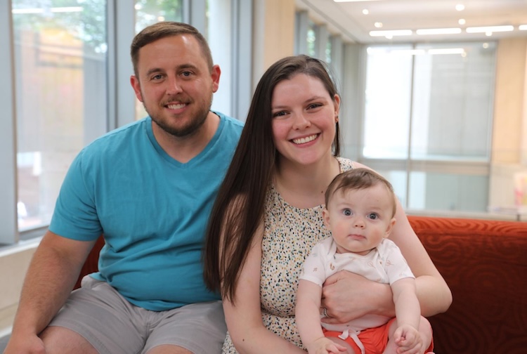 female doctor with husband and baby boy