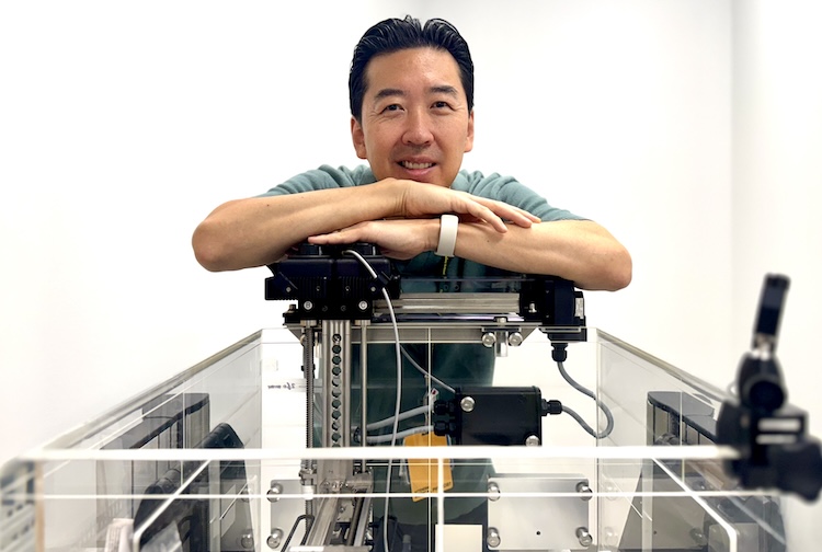 William Song, Ph.D., with water tank device.