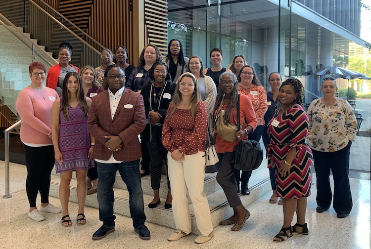 Group standing together after starting their first session in the program