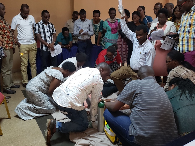 A group of people performing medicine in Rwanda