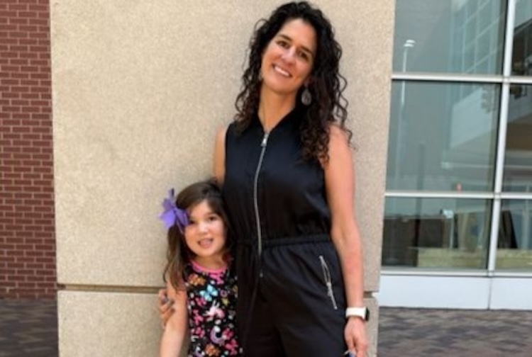 Kristin Roberts stands with daughter Nina, who went to CHoR after a scooter injury.