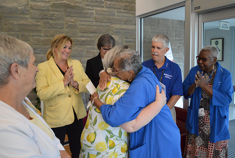 Two people hug in celebration.