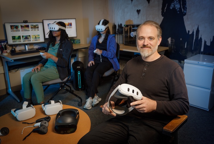 Thomson and participants with VR Headsets in the lab