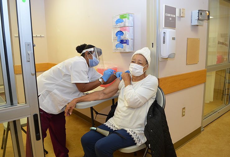 SVCC student Natasha Robinson-Sykes of McKenney vaccinated Elizabeth Kersey, 92 years old. 