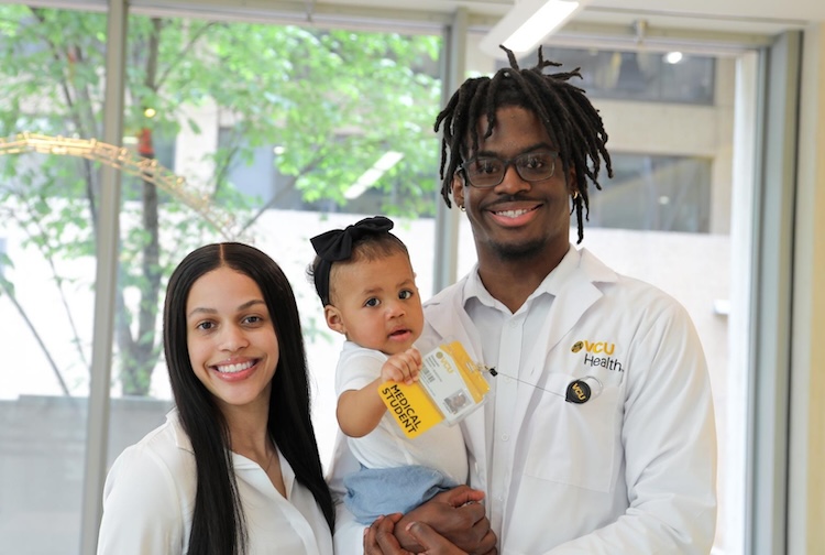 Doctor with fiancÃ© and daughter