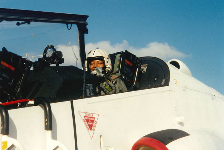 Linda Norman sitting in an F-14