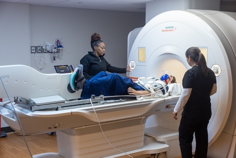 Nurse and technologist prepare patient for an exercise stress test.